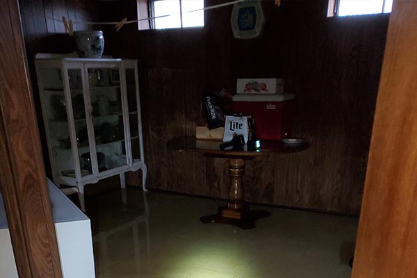 Before image of a water damage restoration job in a flooded basement